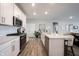 Modern kitchen with island and stainless steel appliances at 5328 Covington Ave, McCordsville, IN 46055