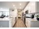 Modern kitchen with stainless steel appliances and white cabinetry at 5328 Covington Ave, McCordsville, IN 46055