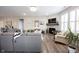 Spacious living room with corner fireplace and ample seating at 5328 Covington Ave, McCordsville, IN 46055