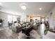 Open concept living room with hardwood floors and stylish furniture at 5328 Covington Ave, McCordsville, IN 46055