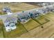 Aerial view of the homes with big backyards and pond and more community houses at 5442 W Turnbuckle Pl, McCordsville, IN 46055