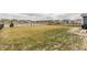 Large backyard featuring a fence, a pond, and a lush lawn, perfect for outdoor activities at 5442 W Turnbuckle Pl, McCordsville, IN 46055