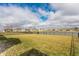 Spacious backyard with lawn and fence, with pond access and views of other homes at 5442 W Turnbuckle Pl, McCordsville, IN 46055