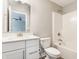 Bathroom with white vanity and cabinets, a shower/tub, and a large mirror at 5442 W Turnbuckle Pl, McCordsville, IN 46055