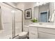 Bathroom featuring a glass-enclosed shower and a stylish vanity with modern fixtures at 5442 W Turnbuckle Pl, McCordsville, IN 46055