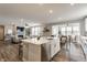 Great view of kitchen with island, stainless steel appliances, open to the living room at 5442 W Turnbuckle Pl, McCordsville, IN 46055