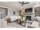 Inviting living room with a gray fireplace, plush seating, and stylish decor at 5442 W Turnbuckle Pl, McCordsville, IN 46055