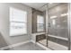 Modern tiled shower stall with glass door and a window at 5442 W Turnbuckle Pl, McCordsville, IN 46055