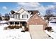 Two-story house with snow-covered yard and attached garage at 5450 Cody Ln, Greenwood, IN 46142