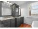 Elegant bathroom with granite countertops and double vanity at 5730 Lawton Loop West Dr, Indianapolis, IN 46216