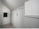 Bathroom with tiled floor, linen cabinets, and shower at 6005 Ralston Ave, Indianapolis, IN 46220