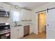 Modern kitchen with white cabinets, stainless steel appliances, and marble countertops at 632 E Mccarty St, Indianapolis, IN 46203