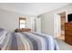 Main bedroom with dresser and striped bedding at 640 Blossom Dr, Avon, IN 46123