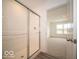 Bright bathroom featuring a glassed-in shower and carpeted room with natural light at 6618 Sulgrove Pl, Indianapolis, IN 46221