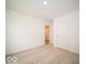 Spacious bedroom with neutral carpet, white walls, and a doorway leading to another room at 6618 Sulgrove Pl, Indianapolis, IN 46221