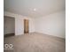 This carpeted bedroom features an ensuite bathroom, offering convenience and privacy at 6618 Sulgrove Pl, Indianapolis, IN 46221