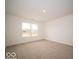 A bright bedroom with large window and carpet, naturally lit and ready for personalization at 6618 Sulgrove Pl, Indianapolis, IN 46221