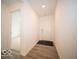 Bright entryway with light wood-look flooring and white walls leading to an open space at 6618 Sulgrove Pl, Indianapolis, IN 46221