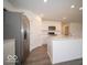 Kitchen features stainless steel appliances, white cabinets, and wood-look floors at 6618 Sulgrove Pl, Indianapolis, IN 46221