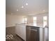 Kitchen island boasts a stainless steel dishwasher and undermounted sink at 6618 Sulgrove Pl, Indianapolis, IN 46221