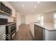 Modern kitchen boasts stainless appliances, a gas stove, and a center island at 6618 Sulgrove Pl, Indianapolis, IN 46221