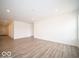 The living room features wood-look flooring, bright walls, and recessed lighting at 6618 Sulgrove Pl, Indianapolis, IN 46221