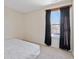 Bright bedroom with a queen-size bed and window at 7015 Cordova Dr, Indianapolis, IN 46221