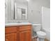 Bathroom featuring wood vanity and white countertop at 7218 Forrester Ln, Indianapolis, IN 46217