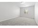 Bedroom featuring carpet flooring and a window at 7218 Forrester Ln, Indianapolis, IN 46217