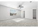 Spacious bedroom featuring carpet flooring, neutral paint, and a bright window at 7218 Forrester Ln, Indianapolis, IN 46217