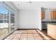 This dining area has a large sliding glass door for natural lighting and wood floors at 7218 Forrester Ln, Indianapolis, IN 46217