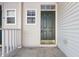 Inviting front porch and door, with neutral siding and well-maintained entryway at 7218 Forrester Ln, Indianapolis, IN 46217