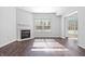 Spacious living room features fireplace, recessed lighting, new floors and sliding glass door at 7218 Forrester Ln, Indianapolis, IN 46217