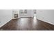 Open-concept living area with fireplace, modern flooring, and ample natural light at 7218 Forrester Ln, Indianapolis, IN 46217