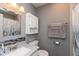 Cozy bathroom with tiled backsplash, vanity with solid surface counter, and shower with curtain at 7775 N Kitchen Rd, Mooresville, IN 46158