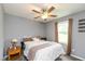 Bedroom featuring neutral walls and a large window with decorative curtains and plush carpet at 7775 N Kitchen Rd, Mooresville, IN 46158