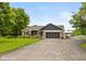 Lovely single-Gathering home featuring an attached garage, paved driveway, and well-maintained lawn and garden at 7775 N Kitchen Rd, Mooresville, IN 46158