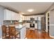 Modern kitchen with white cabinetry, stainless steel appliances, and granite countertops at 7775 N Kitchen Rd, Mooresville, IN 46158