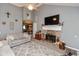 Cozy living room featuring a brick fireplace, a plush rug, and comfortable seating arrangements at 7775 N Kitchen Rd, Mooresville, IN 46158