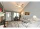Inviting living room featuring vaulted ceilings, neutral paint, modern furnishings, and plush carpeting at 7775 N Kitchen Rd, Mooresville, IN 46158
