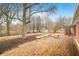 Wooden deck with built-in benches overlooks the backyard at 7817 Dartmouth Rd, Indianapolis, IN 46260