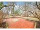 Brick patio and grassy yard with mature trees at 7817 Dartmouth Rd, Indianapolis, IN 46260