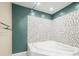 Bathroom with corner bathtub and mosaic tile at 7817 Dartmouth Rd, Indianapolis, IN 46260