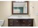 Bathroom with vanity, mirror, and white countertop at 7817 Dartmouth Rd, Indianapolis, IN 46260
