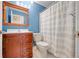 Bathroom with shower/tub, vanity, and wood cabinet at 7817 Dartmouth Rd, Indianapolis, IN 46260