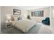 Main bedroom with plush carpet, large window, and stylish decor at 7817 Dartmouth Rd, Indianapolis, IN 46260