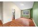 Bright dining room with hardwood floors and view to kitchen at 7817 Dartmouth Rd, Indianapolis, IN 46260