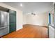 Dining room with hardwood floors and sliding glass doors to backyard at 7817 Dartmouth Rd, Indianapolis, IN 46260
