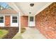 Brick front porch with white door and columns at 7817 Dartmouth Rd, Indianapolis, IN 46260