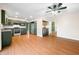 Kitchen features dark green cabinets, stainless steel appliances, and laminate flooring at 7817 Dartmouth Rd, Indianapolis, IN 46260